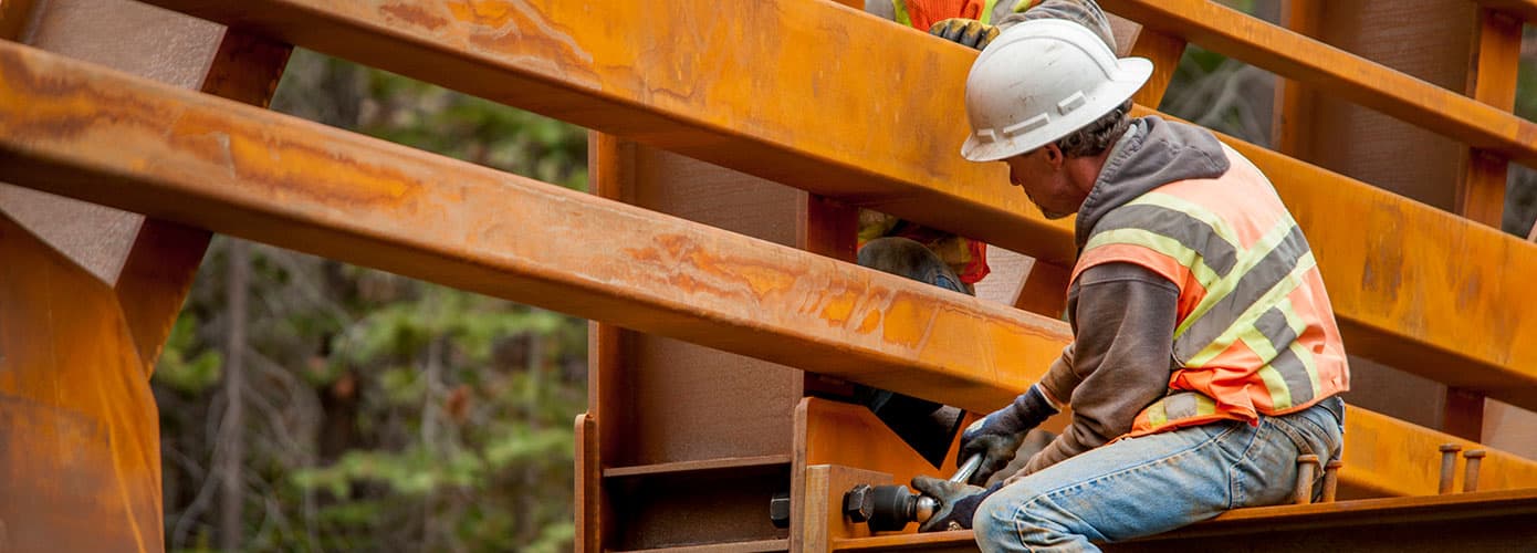 Construction worker on beam